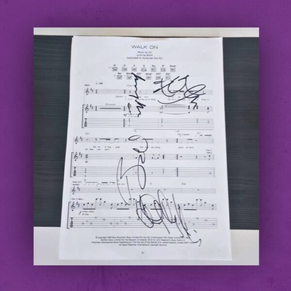 Walk On by U2 sheet music, hand-signed by the band U2